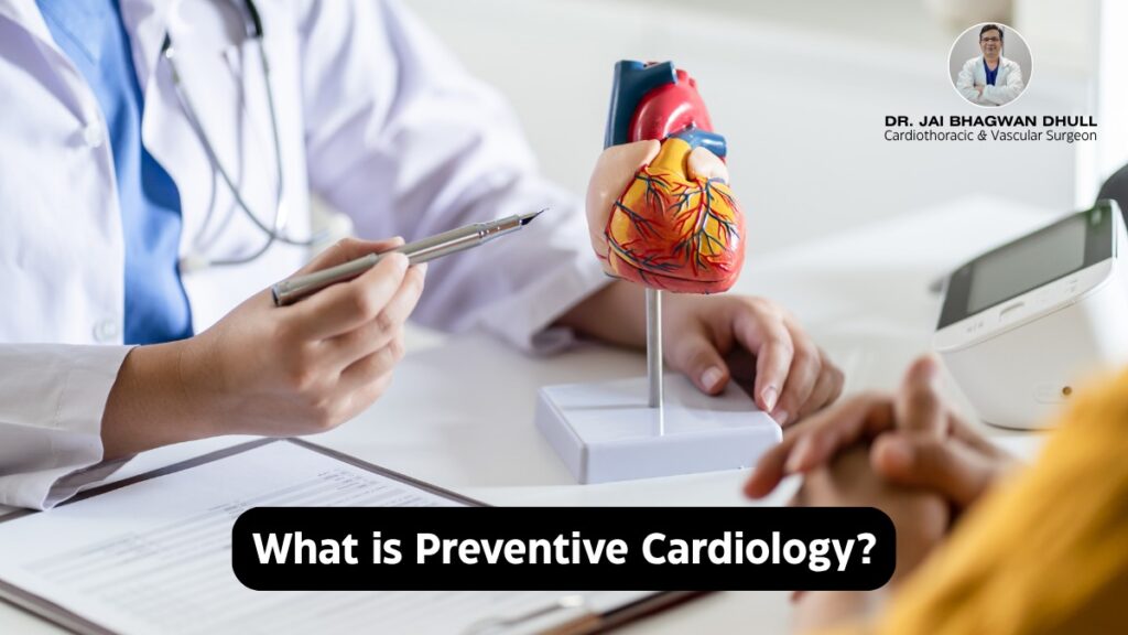Doctor explaning Preventing Cardiology with a heart model on a desk, featuring Dr. Jai Bhagwan Dhull, cardiothoracic and vascular surgeon.