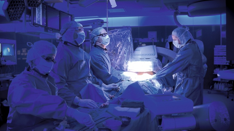 Cardiac surgical team performing a complex procedure in a hybrid operating room, highlighting the use of advanced imaging technology in minimally invasive cardiothoracic surgery led by experts Dr. Jai Bhagwan Dhull.