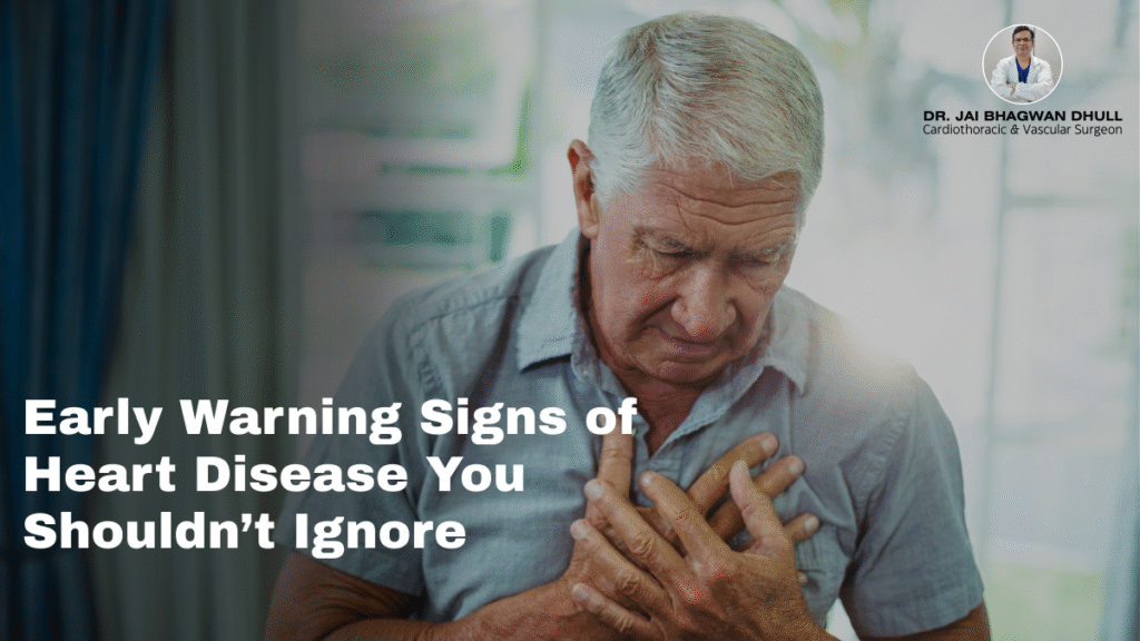 Elderly man clutching chest in pain, highlighting early warning signs of heart disease by Dr. Jai Bhagwan Dhull, Cardiothoracic & Vascular Surgeon.