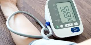 Blood pressure check showing 120/80 mmHg on a digital monitor – healthcare guidance by Dr. Jai Bhagwan Dhull.