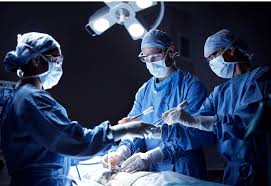 Team of surgeons performing a complex operation in a well-lit operating room, showcasing advanced surgical expertise associated with Dr. Jai Bhagwan Dhull, cardiothoracic and vascular specialist.
