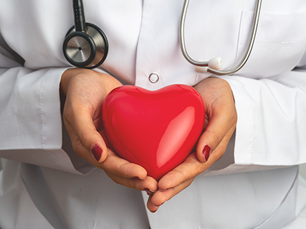Doctor holding a red heart model symbolizing heart health and cardiac care | Dr. Jai Bhagwan Dhull